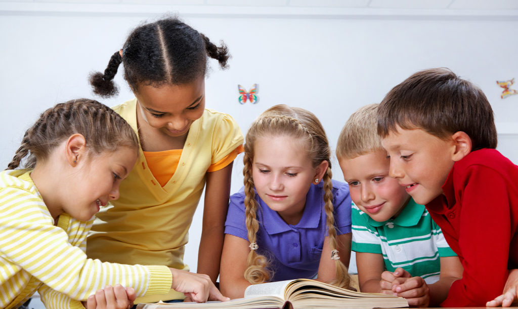 children reading together in group