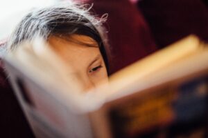 young child reading a book