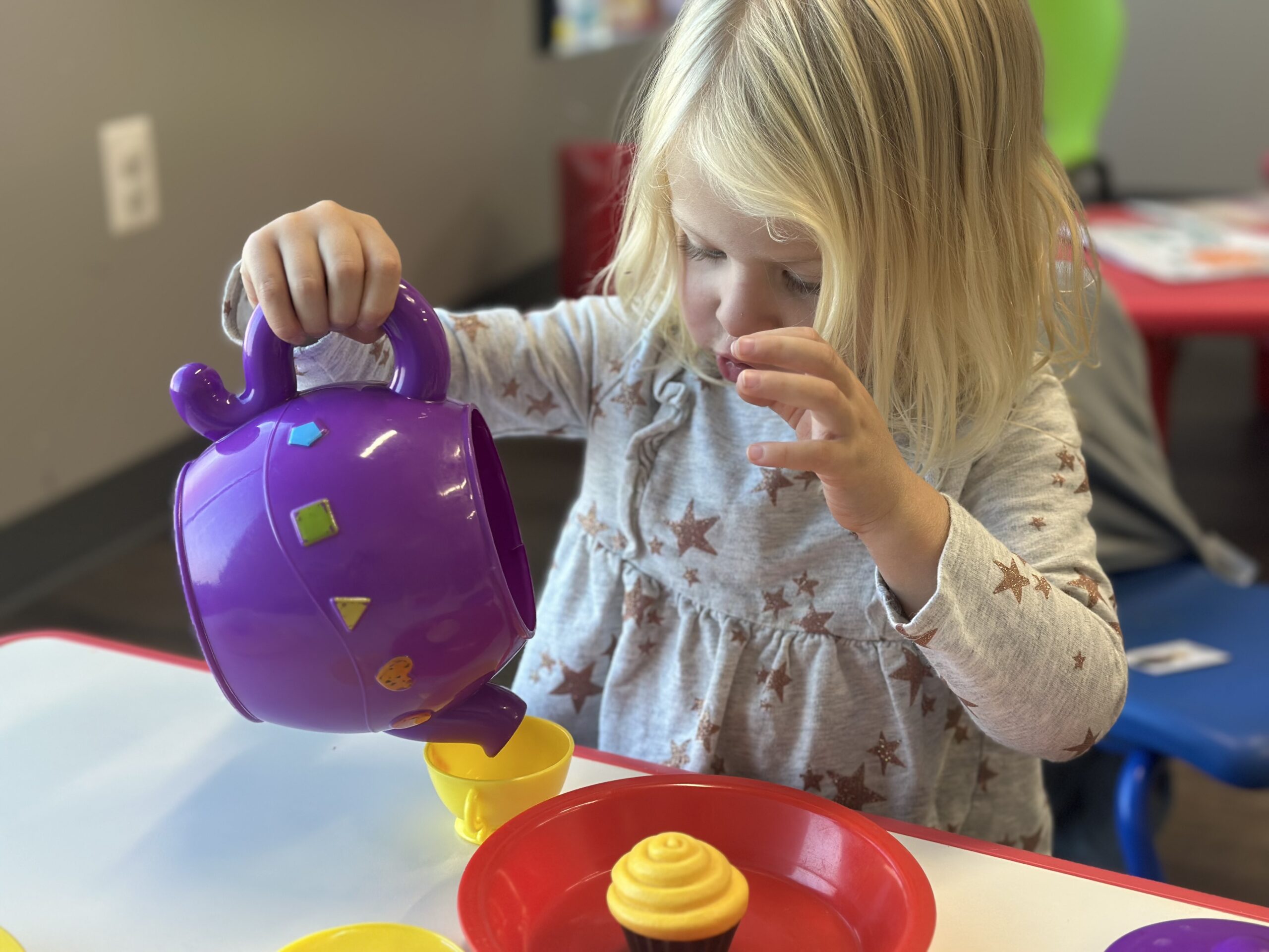 Young girl playing with developmental toys